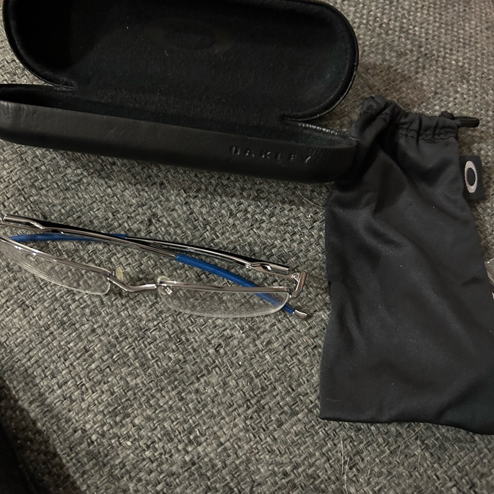 Oakley Men’s Blue and Silver Rimless Eyewear